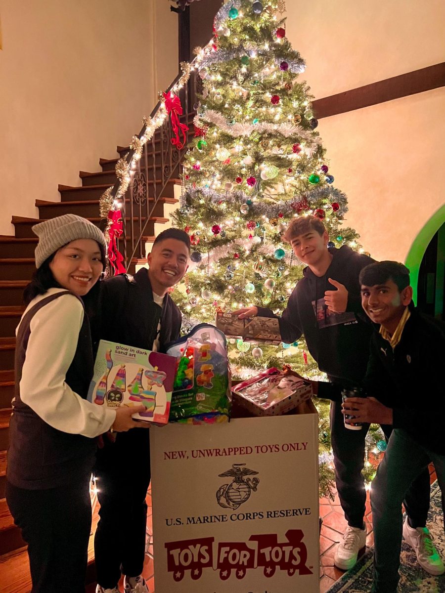 Dean Sean, Daniel, Tilak, and Tiffany donate toys at Dr. M.s coco and cookies event. December 7th, 2023.