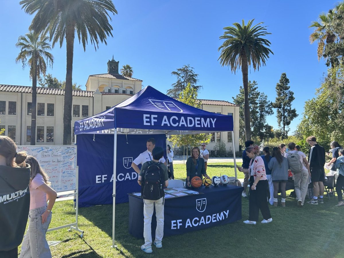 The athletics booth hosted by Coach Clapp and Coach Gabby invites students and staff to learn about the importance of sports and exercise.