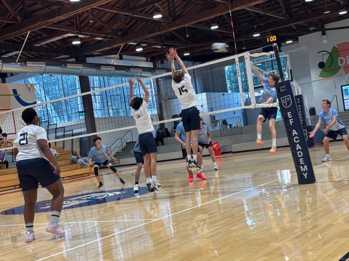 Benetin and his teammate going in for a block against Chadwick.