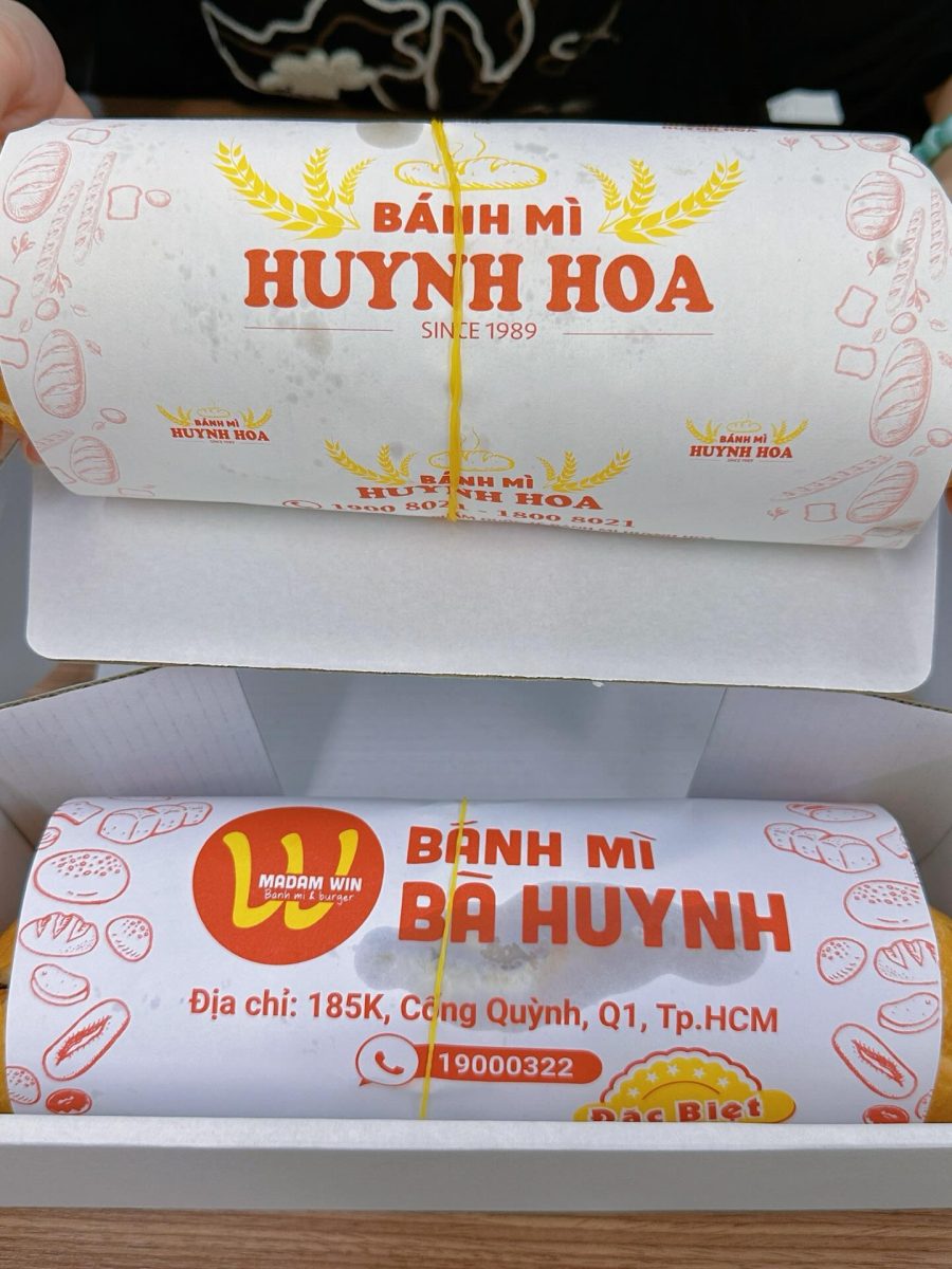 Each bánh mì is tightly wrapped in thick paper with the shop’s logo and secured with a rubber band before being placed in a box. The packaging reflects the sandwich’s size and helps contain the messy filling.