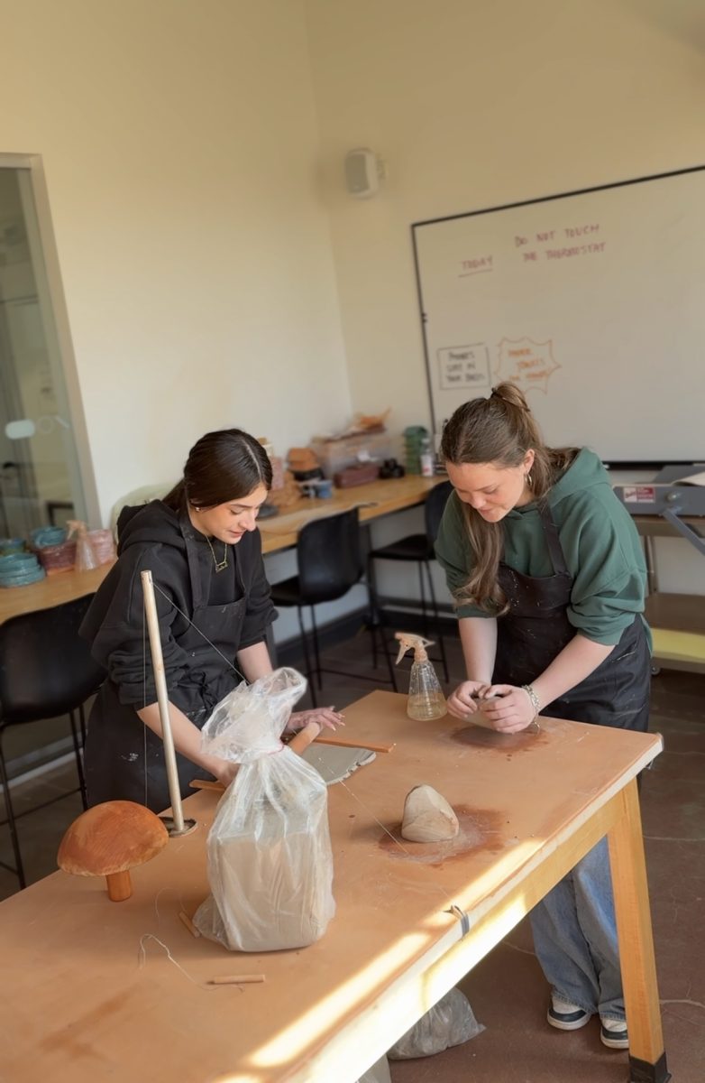 Melina and Gwyn creating ceramic bowls 