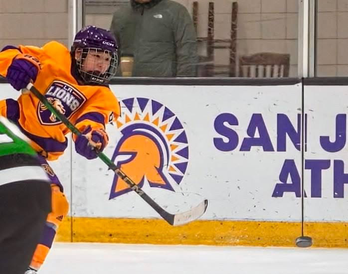 Adele Johnson lunges across the ice.