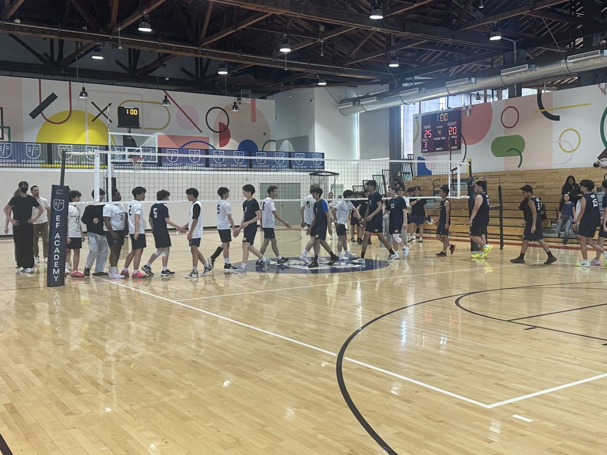 The EF boys' volleyball team handshaking Webb's team following their victory.